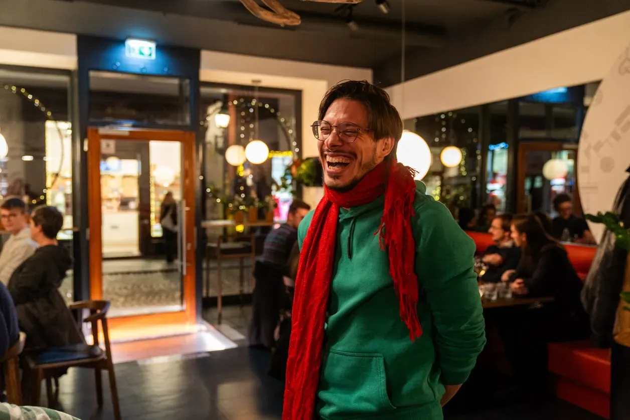 Sašo smiling in a bar